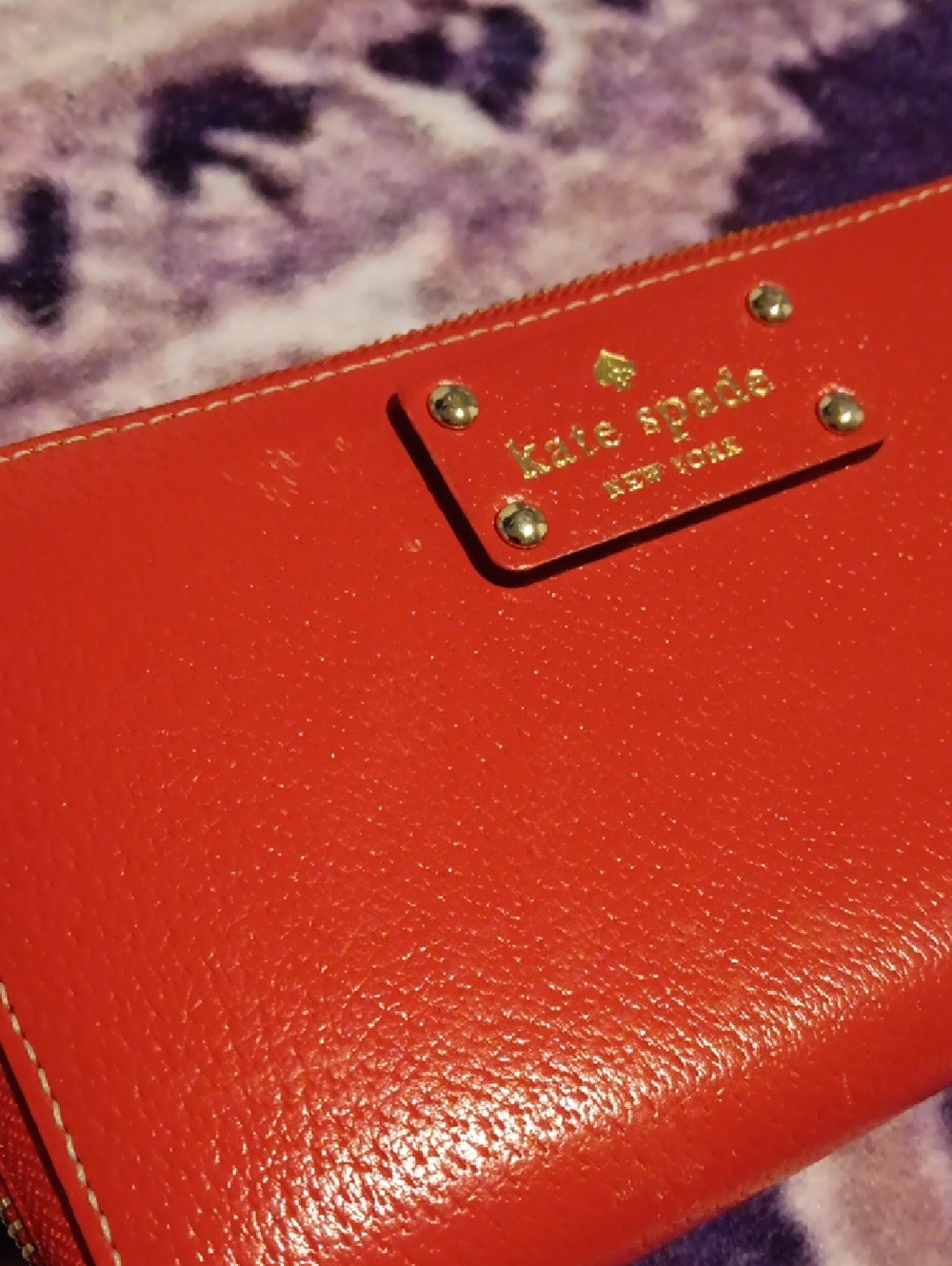 kate spade red leather zip wristlet with gold logo